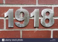 metal-house-number-1918-on-a-red-brick-wall-FW2AKT.jpg